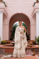 Hand embroidered short shirt and sharara set with dupatta, embellished with beads, cutdana, and sequins.