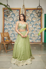 Green Net Sweetheart Neck Embellished And Woven Lehenga Set