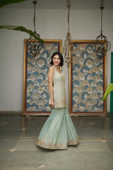 Ice blue tissue gharara with a honeybee jaal & sequin embellishments.