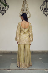 A sea green floral jaal adorned with delicate sequin embellishments.
