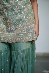Sage green tissue with sequin, bead, resham & moti nature inspired embellishments.