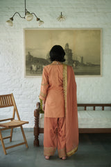 Rusty silk gharara set with sequin, zari & beadwork.