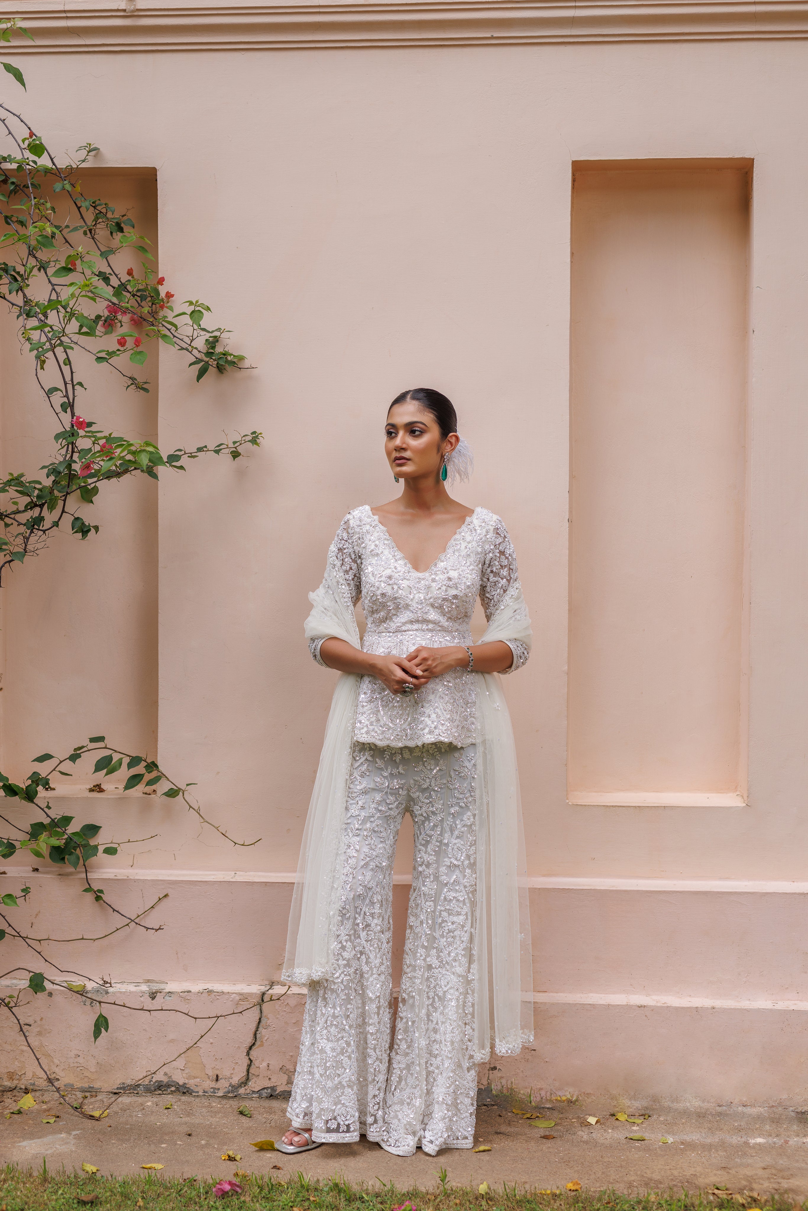 Exquisite pastel ivory peplum with floral detailing and sparkling beadwork from our bridal and bridesmaid collection.