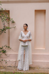 Exquisite pastel ivory peplum with floral detailing and sparkling beadwork from our bridal and bridesmaid collection.